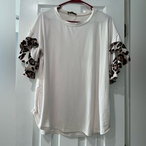 White tunic length shirt with leopard accents